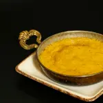 La polenta taragna: storia del piatto simbolo delle valli bergamasche, farina di grano saraceno e ristoranti dove mangiarla come una volta